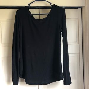 Black long sleeve top with crossed open back